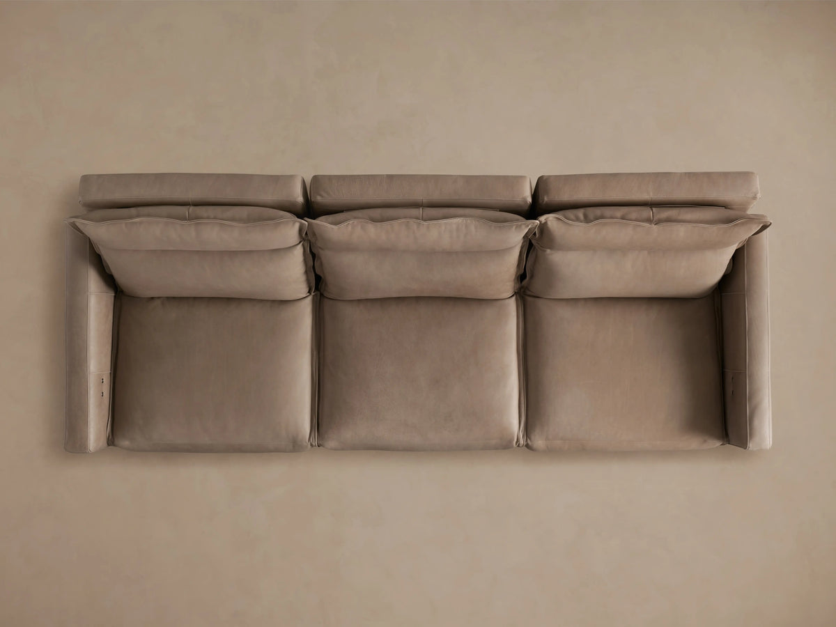 Rowland Leather Three-Piece Motion Modular Sofa shown with gray leather finish, three seats, reclined positions, and footrests extended.