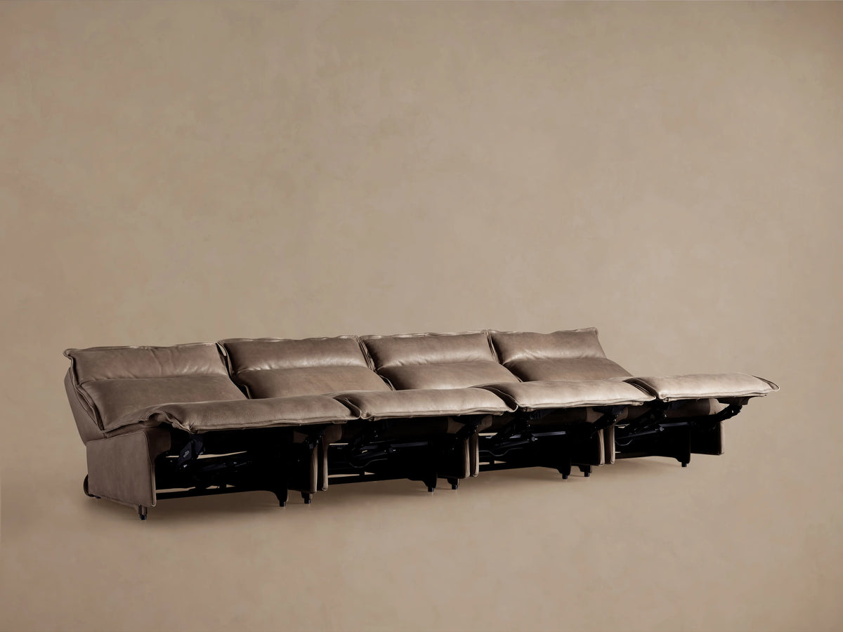 Rowland Leather Four-Piece Armless Motion Modular Sofa shown from the back, featuring four armless reclining sections in a taupe leather finish.