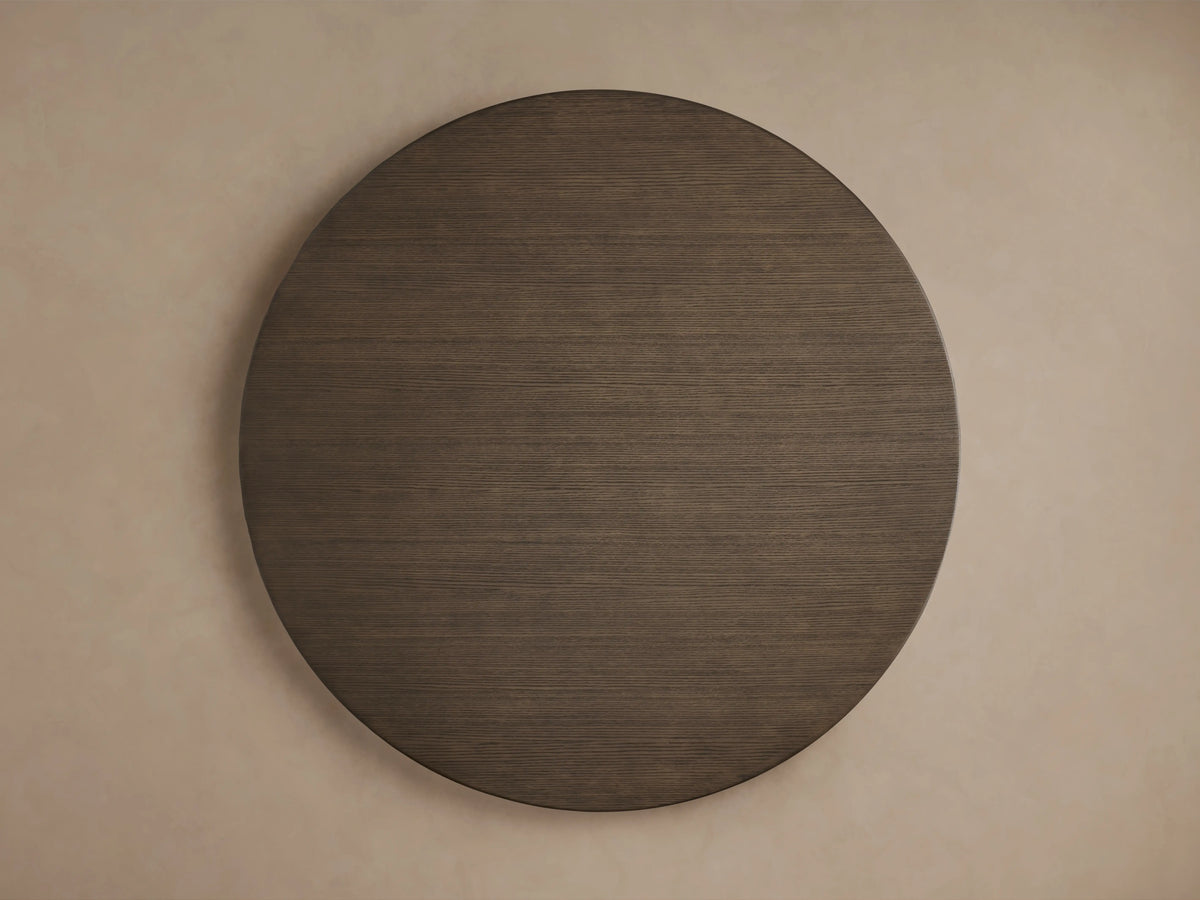 Saint Germain dining table features a round solid oak top with visible wood grain, finished in a rich chestnut hue.