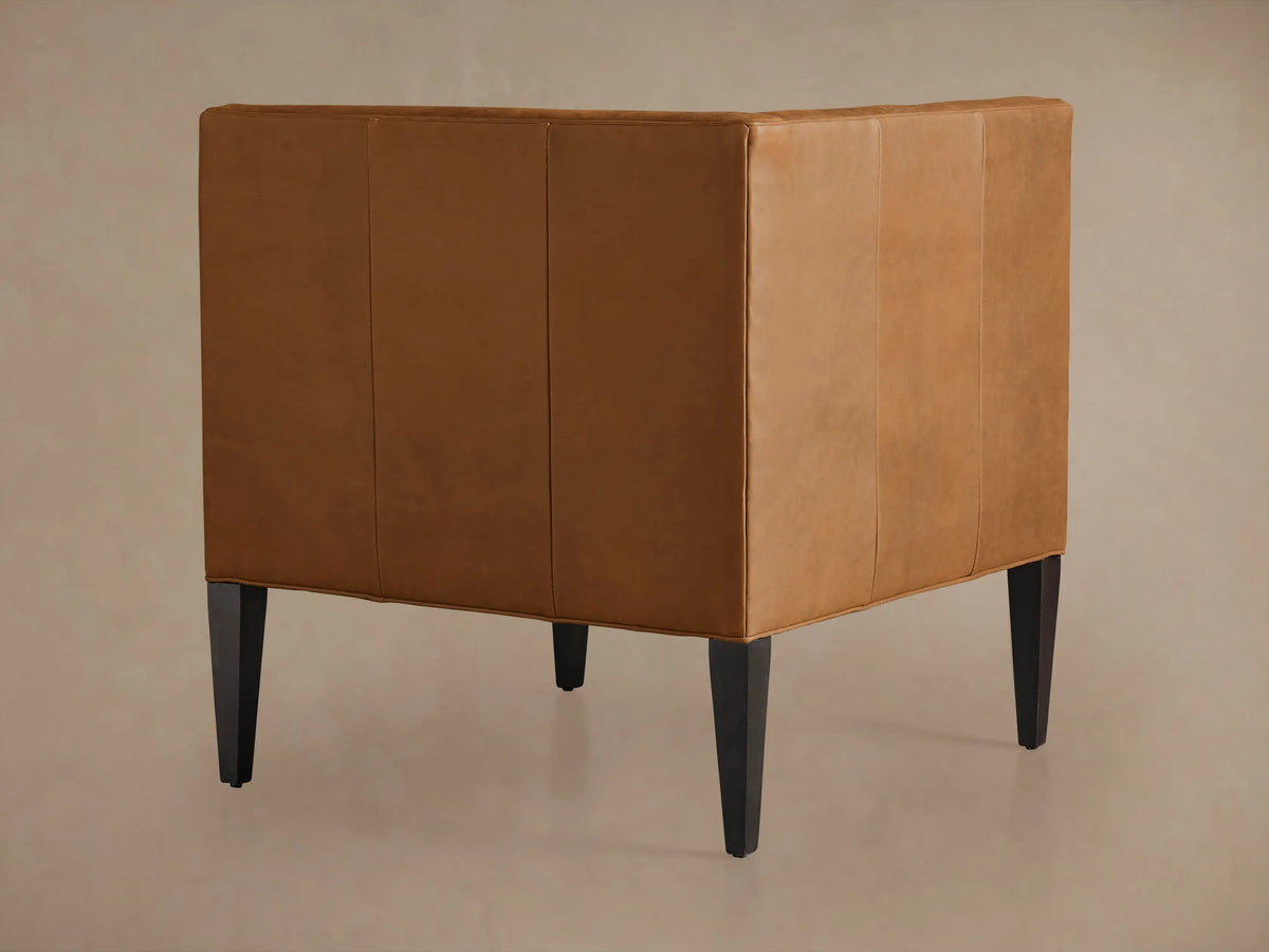 Gates Leather Corner in warm brown Norre recycled leather, channel-stitched curved back, and plush seat.