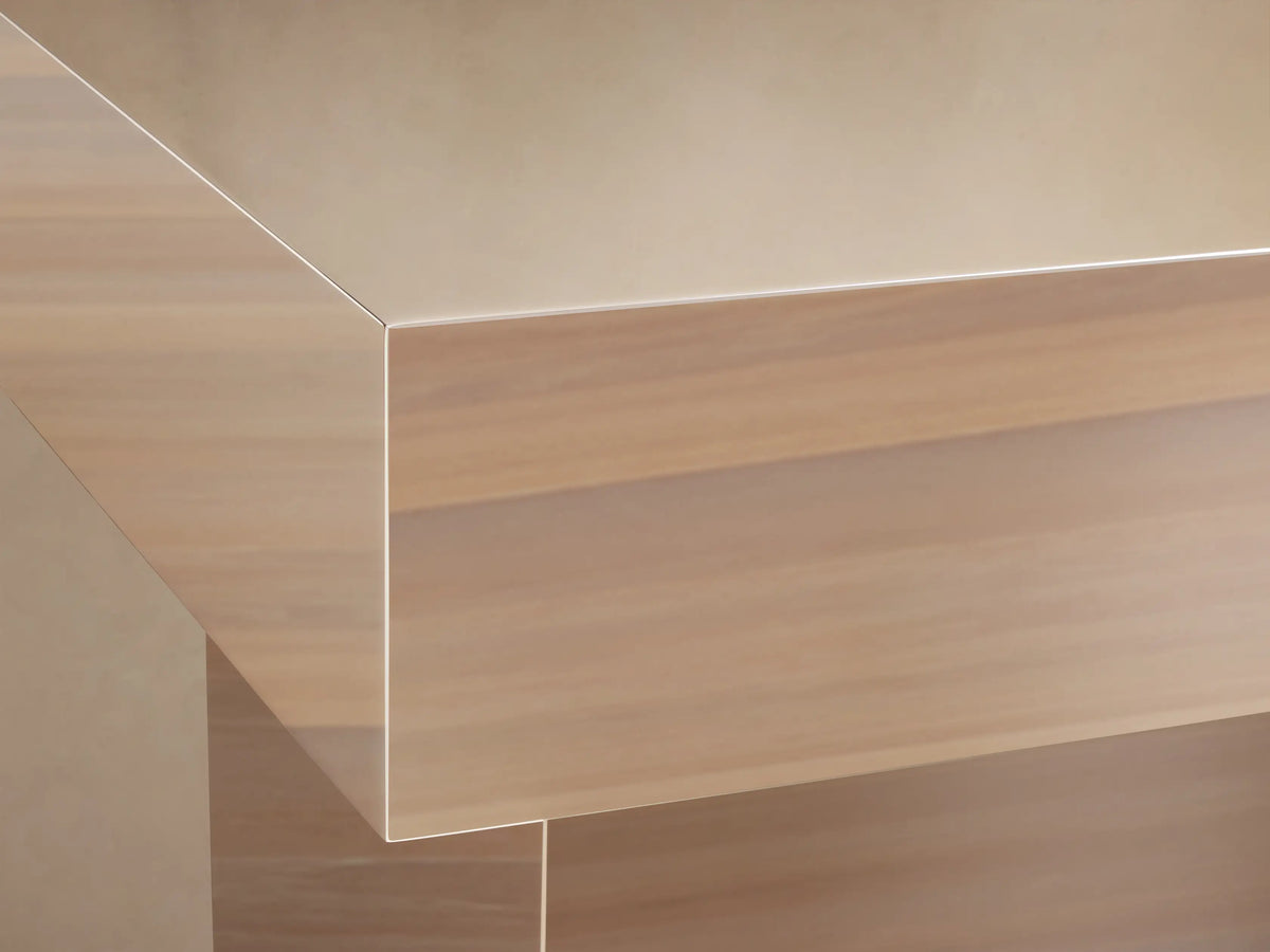 Front view of the Chrome Cinzia Chrome End Table, a radiant, mirror-like metallic table with a geometric plinth base.