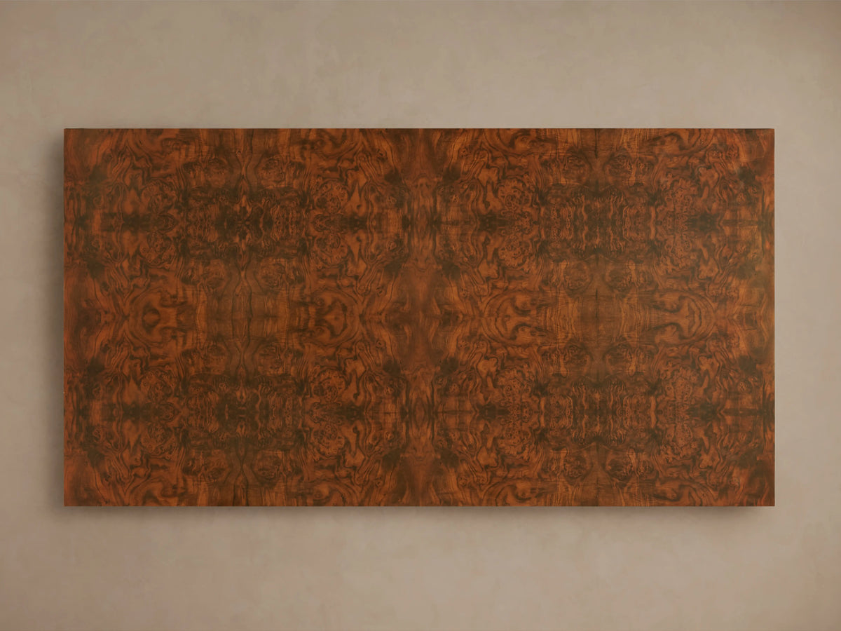 Cinzia Burl Coffee Table showcasing a rich walnut burl wood veneer with intricate bookmatched patterns and a low-profile, plinth-style base.
