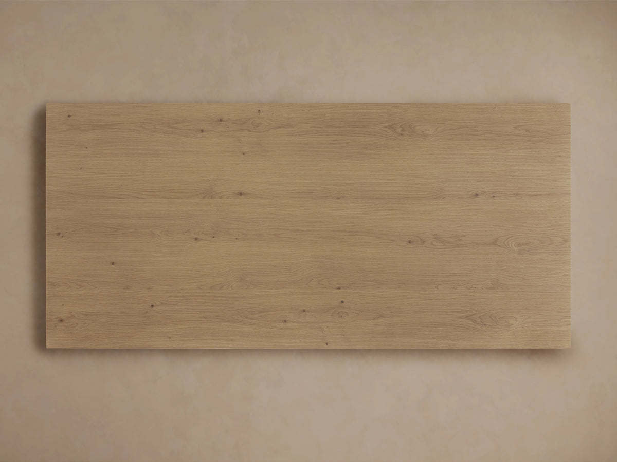 Felton Coffee Table made from solid oak, showcasing a rectangular shape with an open shelf design. Light brown finish on wood grain.