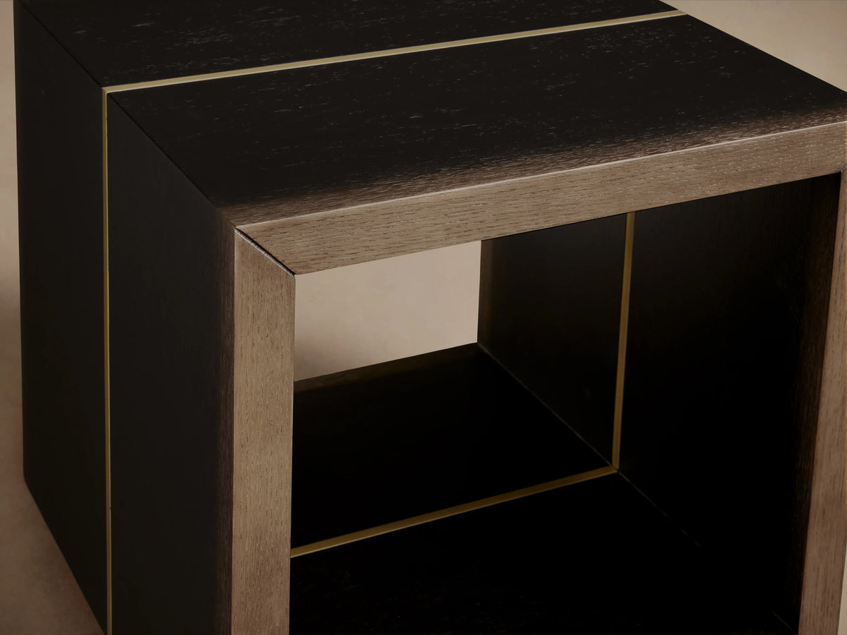 Mihaela End Table, dark walnut wood cube with open center, subtle bronze metallic accents, on a light wood floor.
