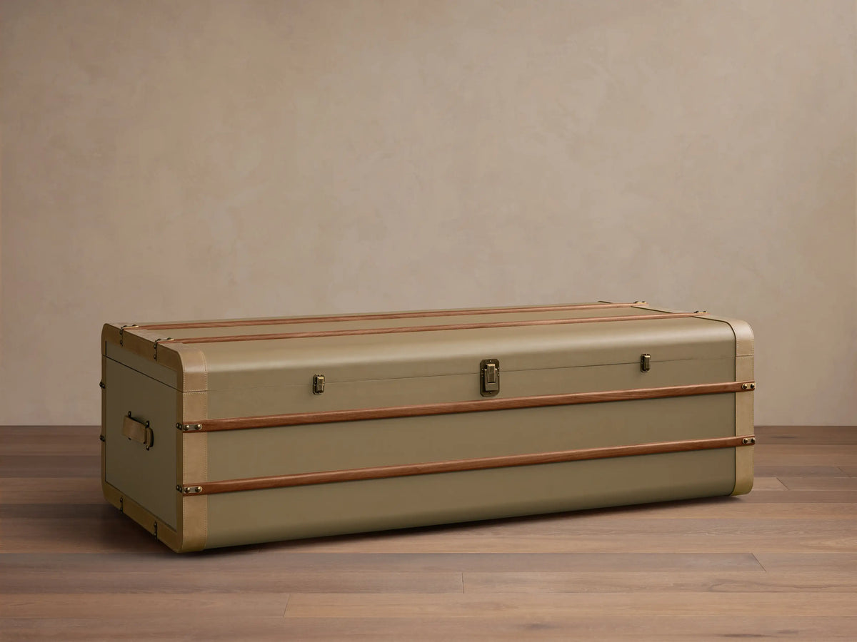 Top view of the rectangular olive-colored Oberlin Storage Coffee Table with two wood strips and beige leather trim.