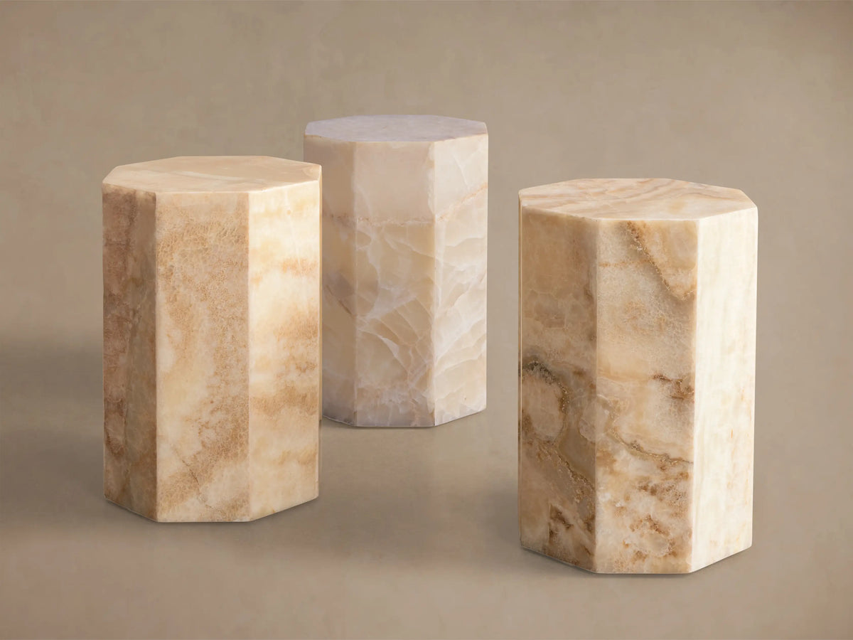 Odelia Onyx Stool: overhead view of an octagonal, honed solid onyx top with natural ivory and beige color variations.