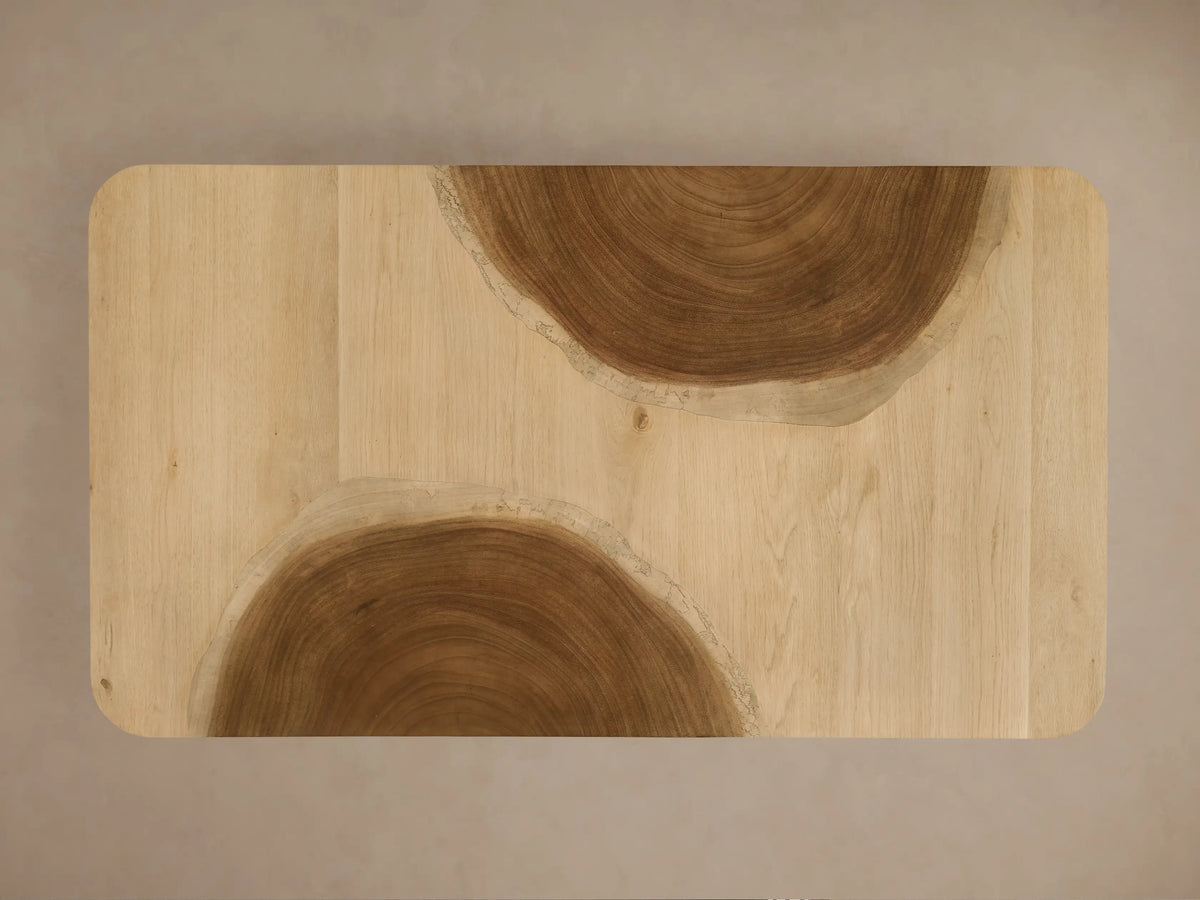 Ramiro Coffee Table with wavy American oak & Guanacaste wood pattern across its curved top & side.