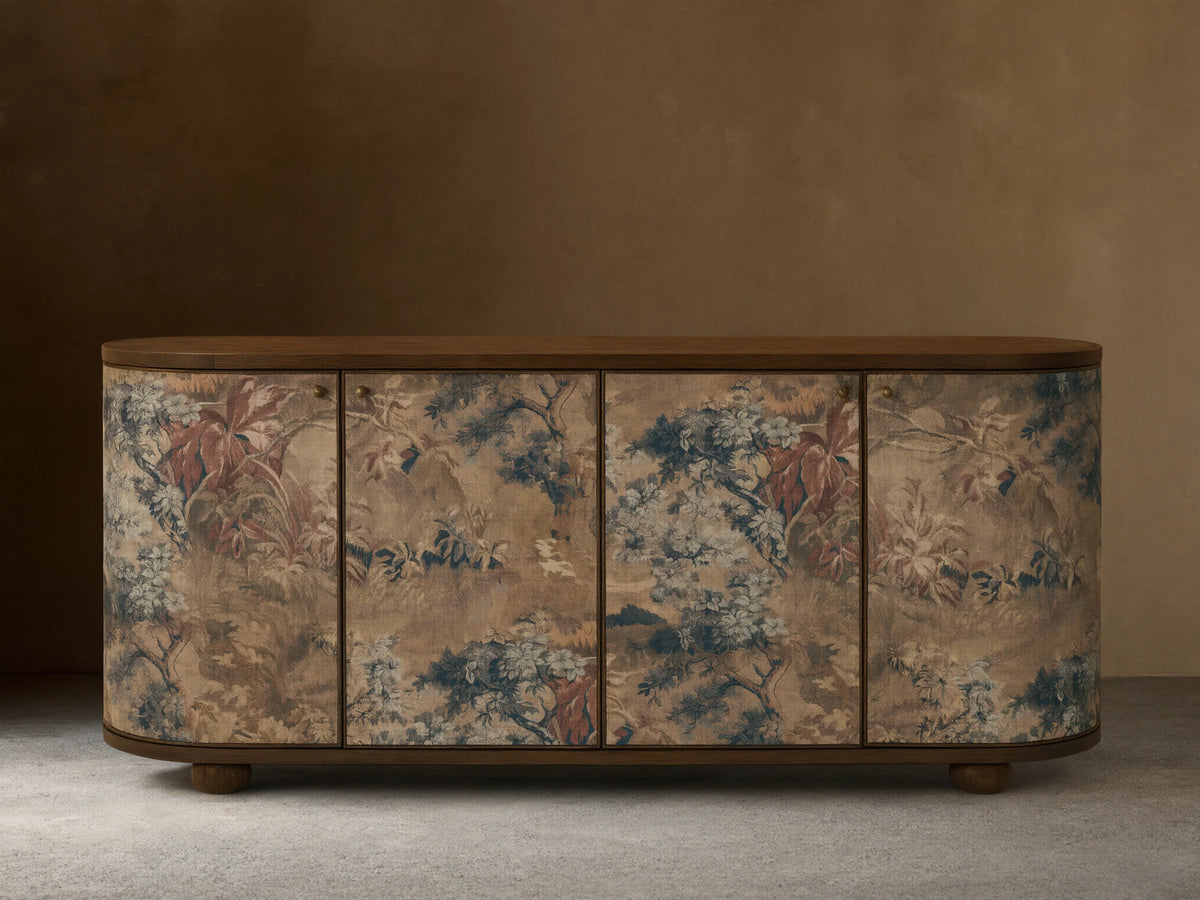 Front view of Fresca Sideboard with rounded ends, light brown wood top and base, and a linen fabric overlay with muted nature motifs.