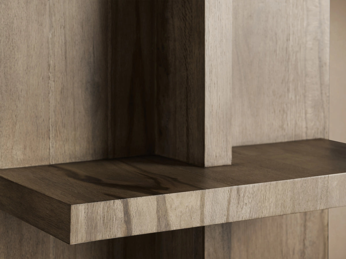 Close-up of Leandro Bookcase showing two intersecting wood shelves. The wood's natural grain and spalted oak finish are visible.