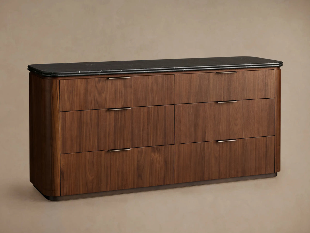 Caden Six-Drawer Dresser, dark walnut wood veneer with black marble top. Top drawer open, showing bronze edge-pull hardware.