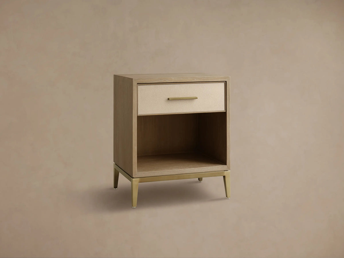 Front view of the Bone Malone Open Nightstand with a top drawer featuring a textured bone-colored front, an open shelf, and metallic gold base.