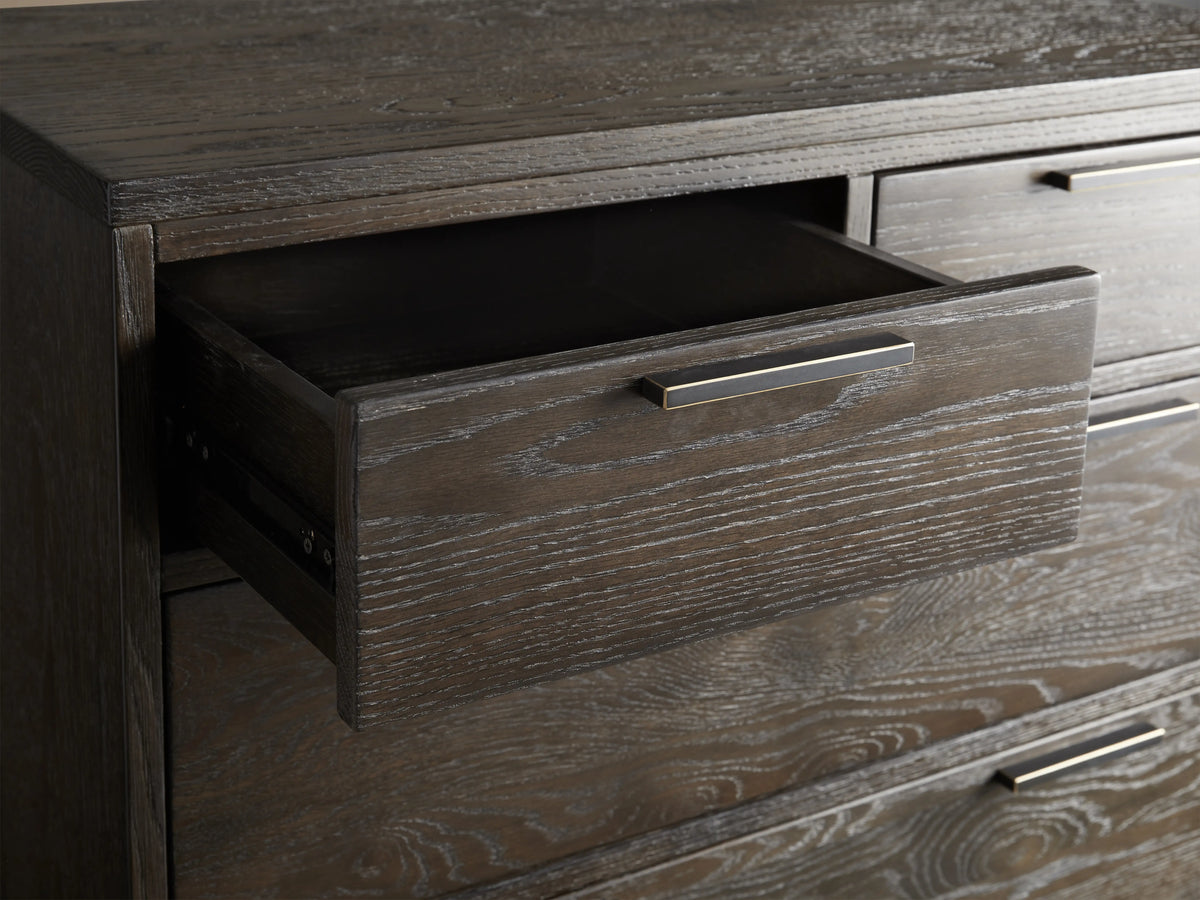 Palmer Six-Drawer Dresser in dark wood finish with sleek black iron handles. Tall rectangular design on slim black metal legs.
