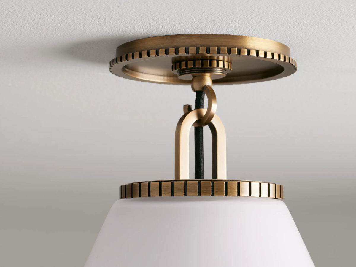 Wescott Cone Flush Mount with a white cone shade and brass finish, mounted on a ceiling, featuring decorative detailing.