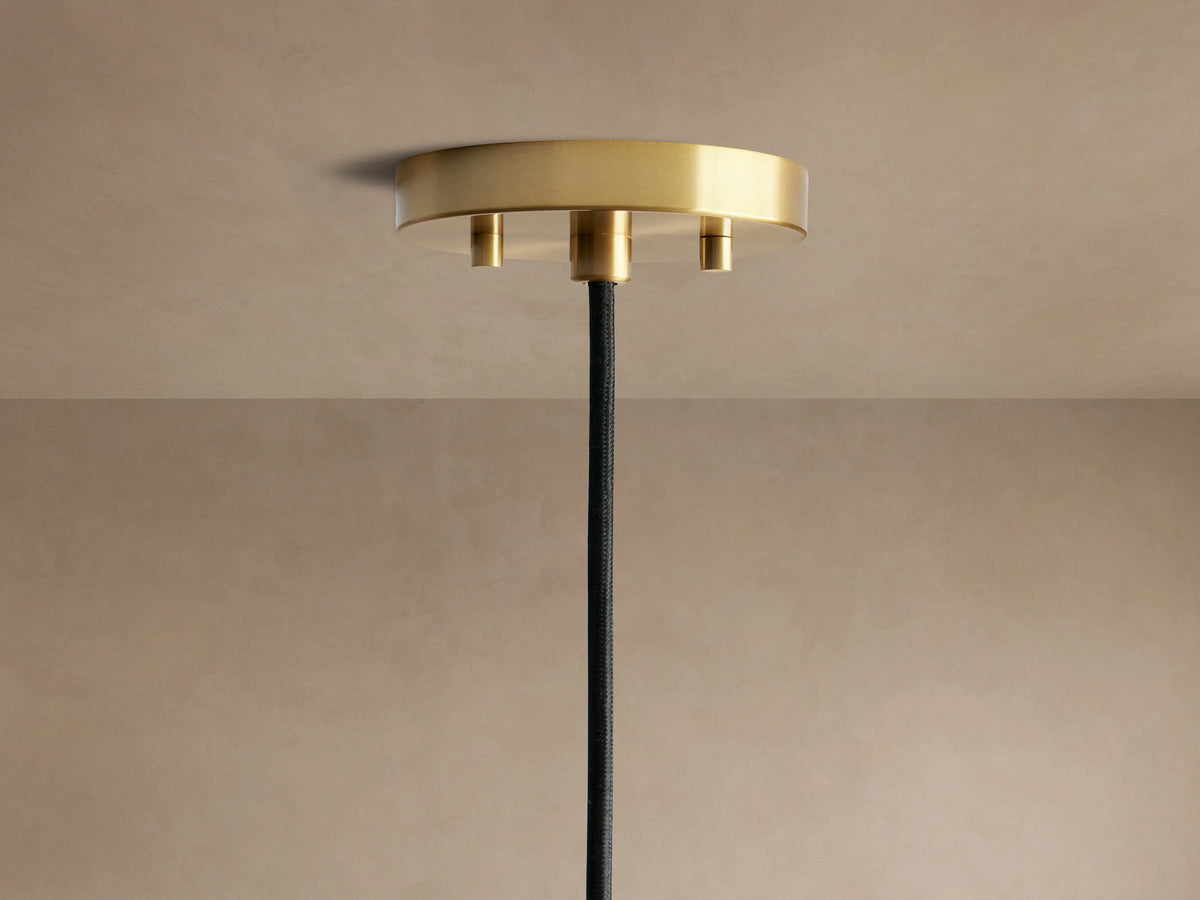 Organic 8" Pendant with smoky gray mouth-blown glass, subtle bubbles, brass hardware, and a warm filament bulb.