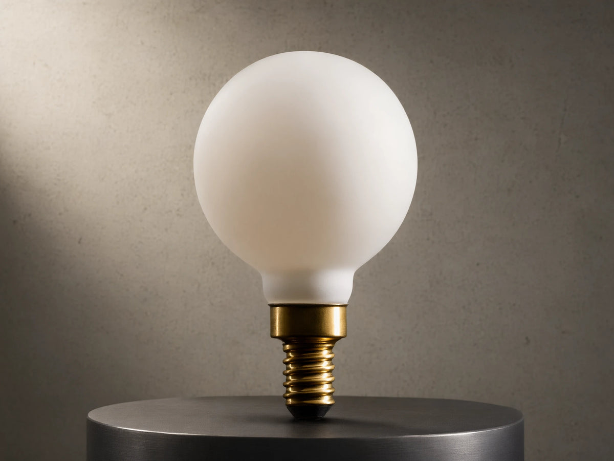 LED G16 Filament E12 Bulb with frosted glass, spherical shape, and visible brass screw base, against black background.