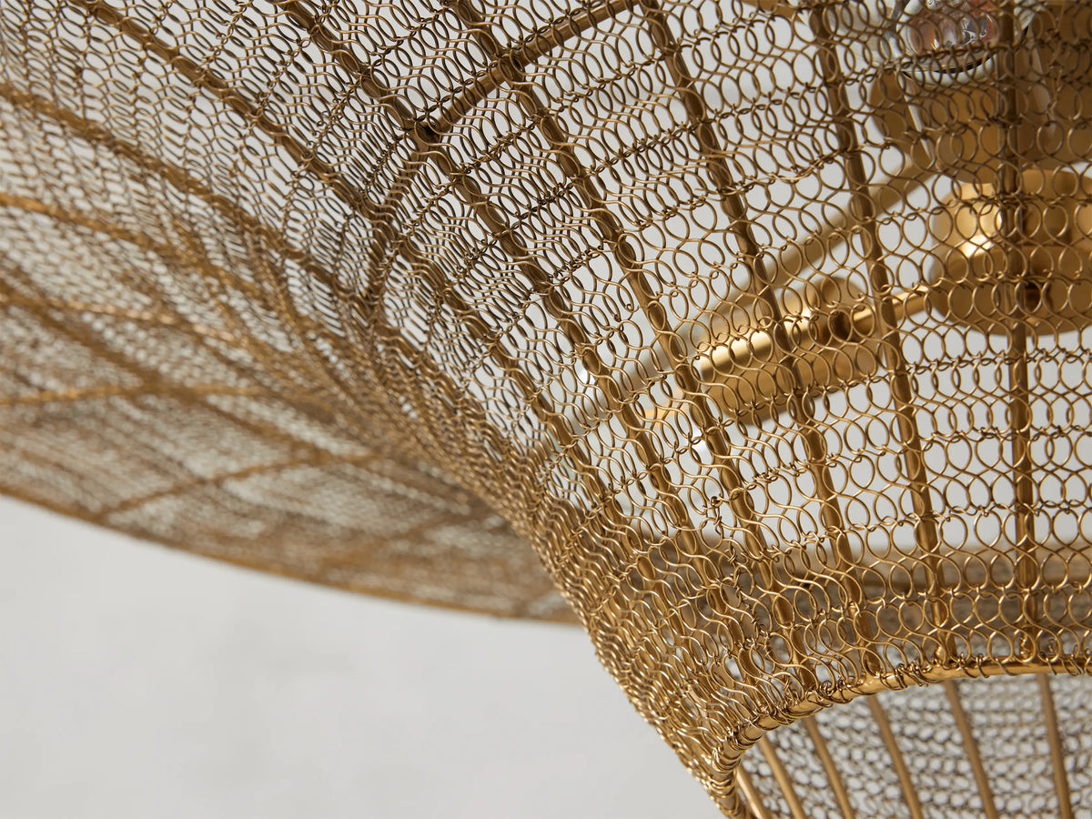 Mirza Caping Chandelier in Antique Brass, featuring a woven stainless steel and brass design with a large, flared shape.