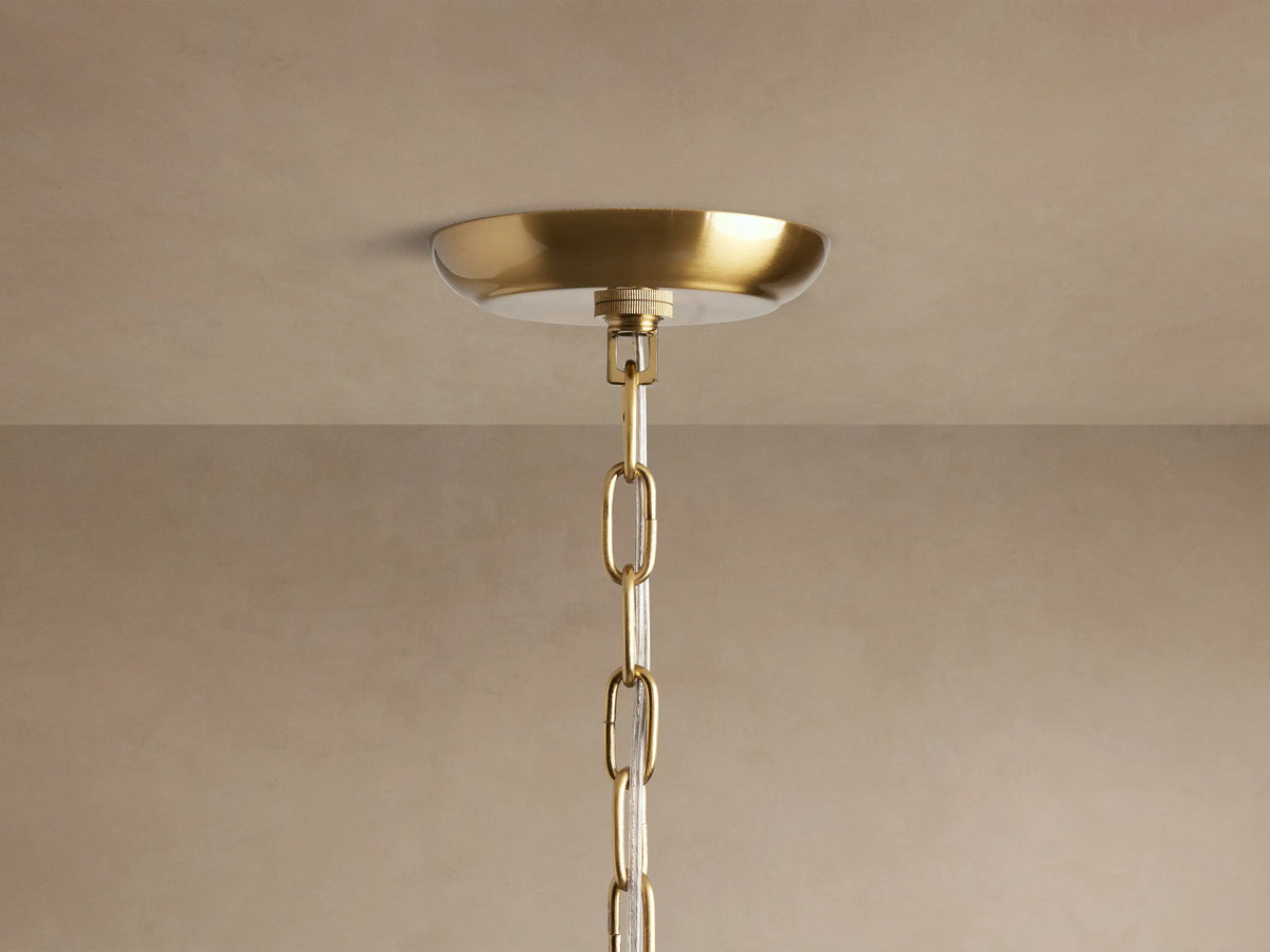 Close-up of Dandelion Round Chandelier with radiant silver rods, numerous clear glass crystals, and glowing bulbs.