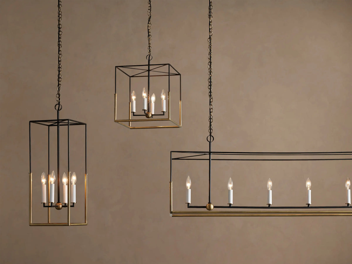 Close-up of the Holt Linear Chandelier's rectangular antiqued brass ceiling canopy. A brass chain and a black cord with brass links hang.