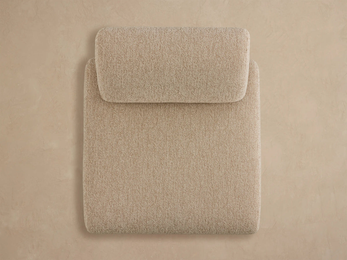 Angled rear view of a Gianni Outdoor Lounge Chair upholstered in light beige textured fabric with a modern, blocky design.