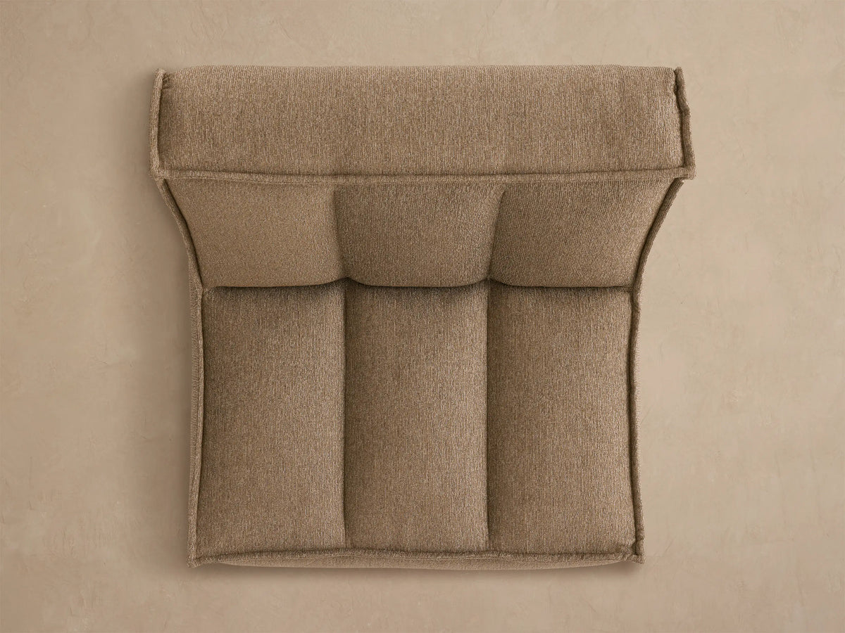 Back view of Porto armless chair in dark beige fabric with channel stitching