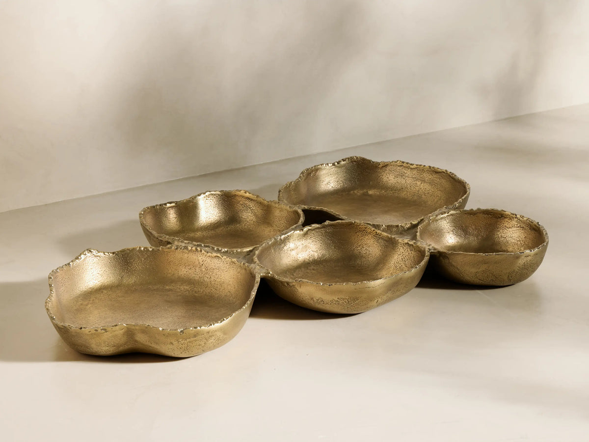 Front view of a gold Aurelian Multi Tray with five interconnected, organically shaped, rough-edged compartments.