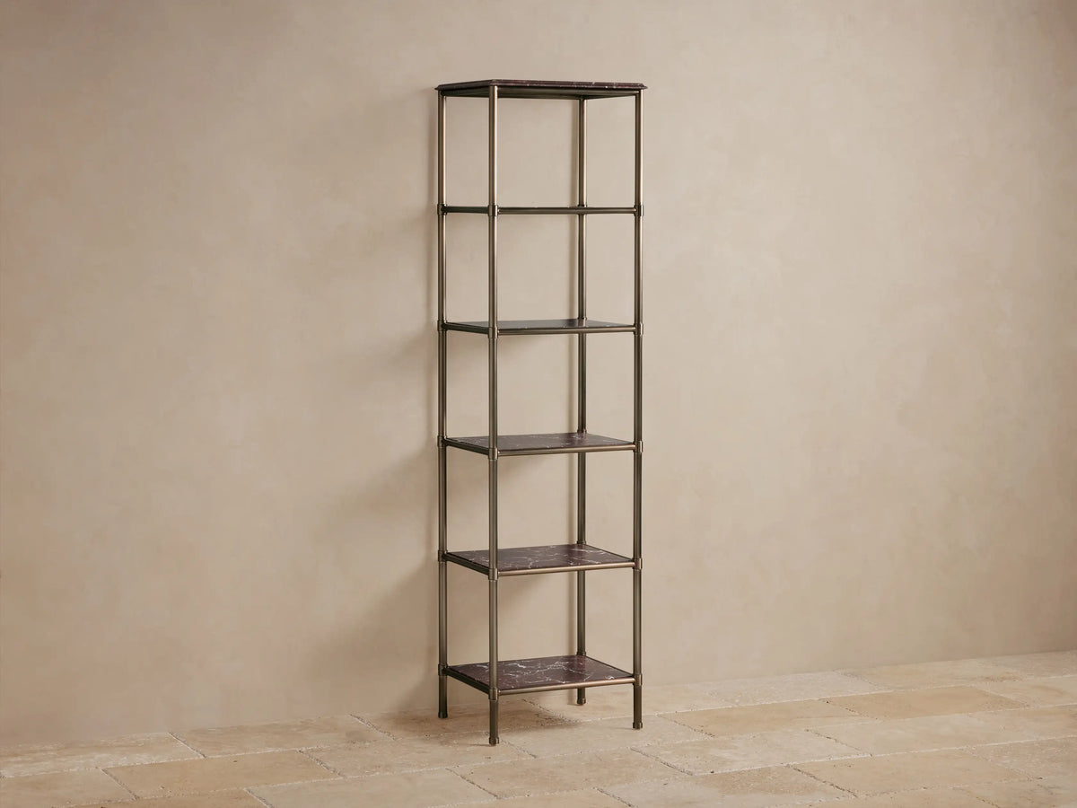 Close-up of Chelsea Tall Etagere's Brown Espresso marble top with detailed edge and antique brass-finished metal frame.