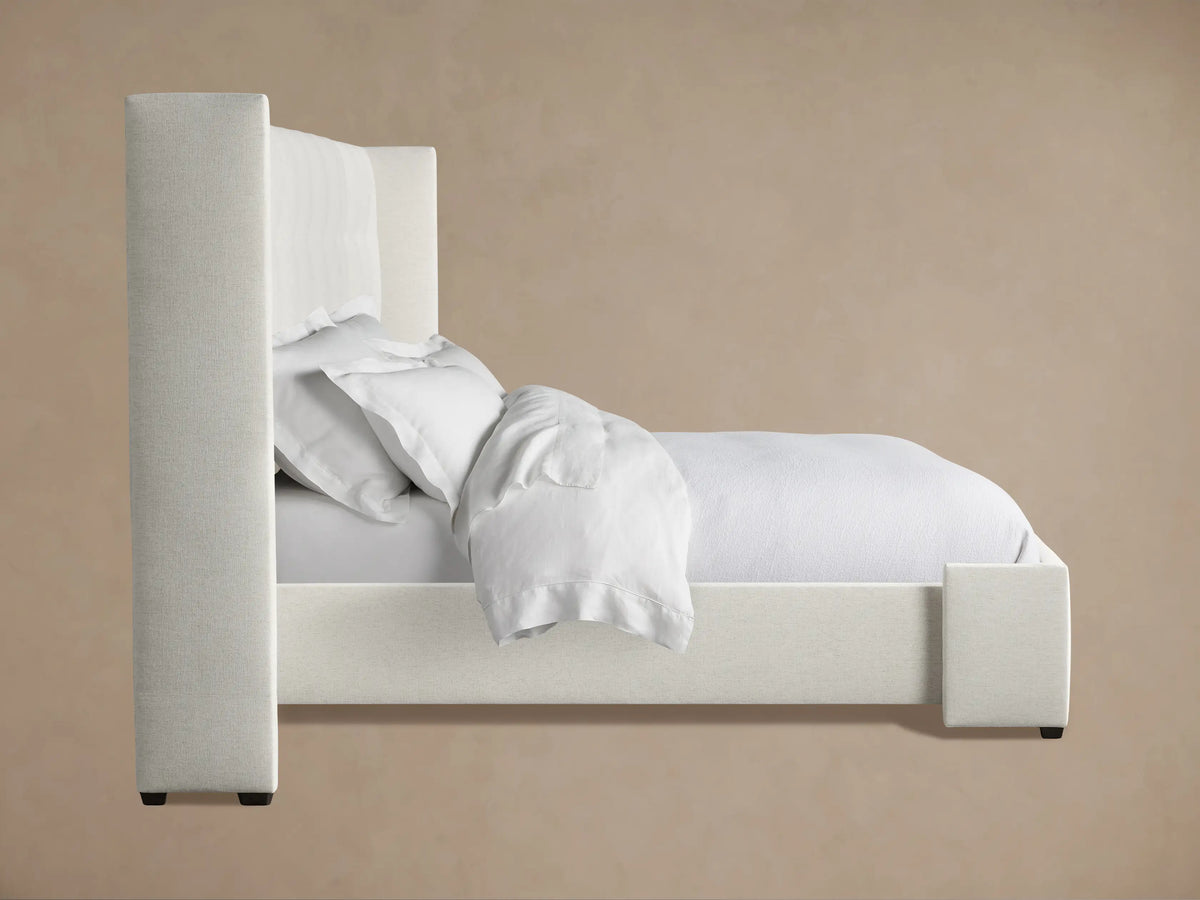 Wyller Box-Tufted Extended Headboard, close-up of light textured fabric with visible tufts, angled showing side.