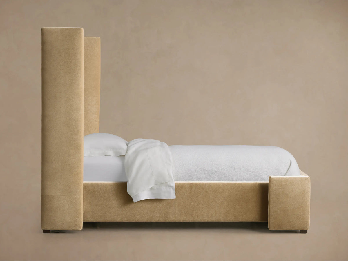 Close-up of Wyller Channel-Stitched Twin Bed headboard, featuring plush, vertically channel-stitched taupe fabric.