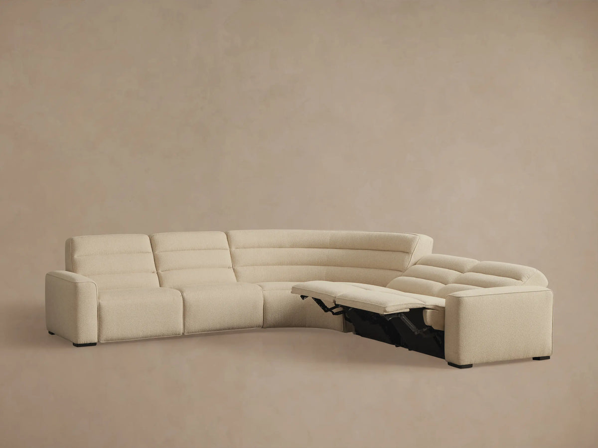 Cream Borough Five-Piece Motion Corner Sectional, with one left section reclined and backrests featuring horizontal tufting.