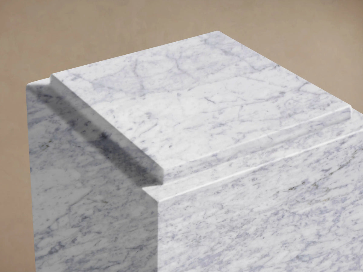 Front view of the white marble Marmont Pedestal with gray veining, rectangular and upright.