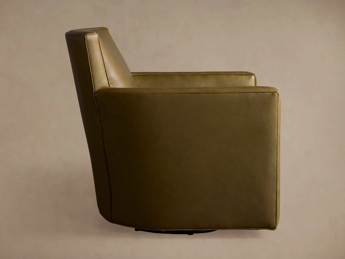 Rudy Leather Swivel Chair in an earthy olive green, viewed from its side and back, showing the tall back and curved arm.