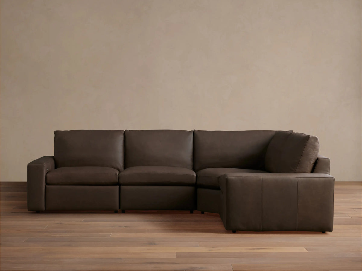 Kipton Wide Arm Leather Four-Piece Motion Sectional