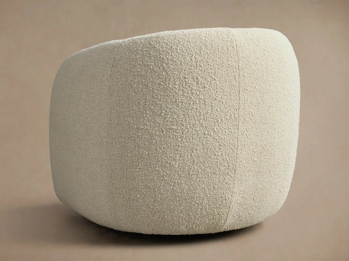 Front view of a cream boucle Fresno Swivel Glider, featuring curved arms and a deep, rounded back.