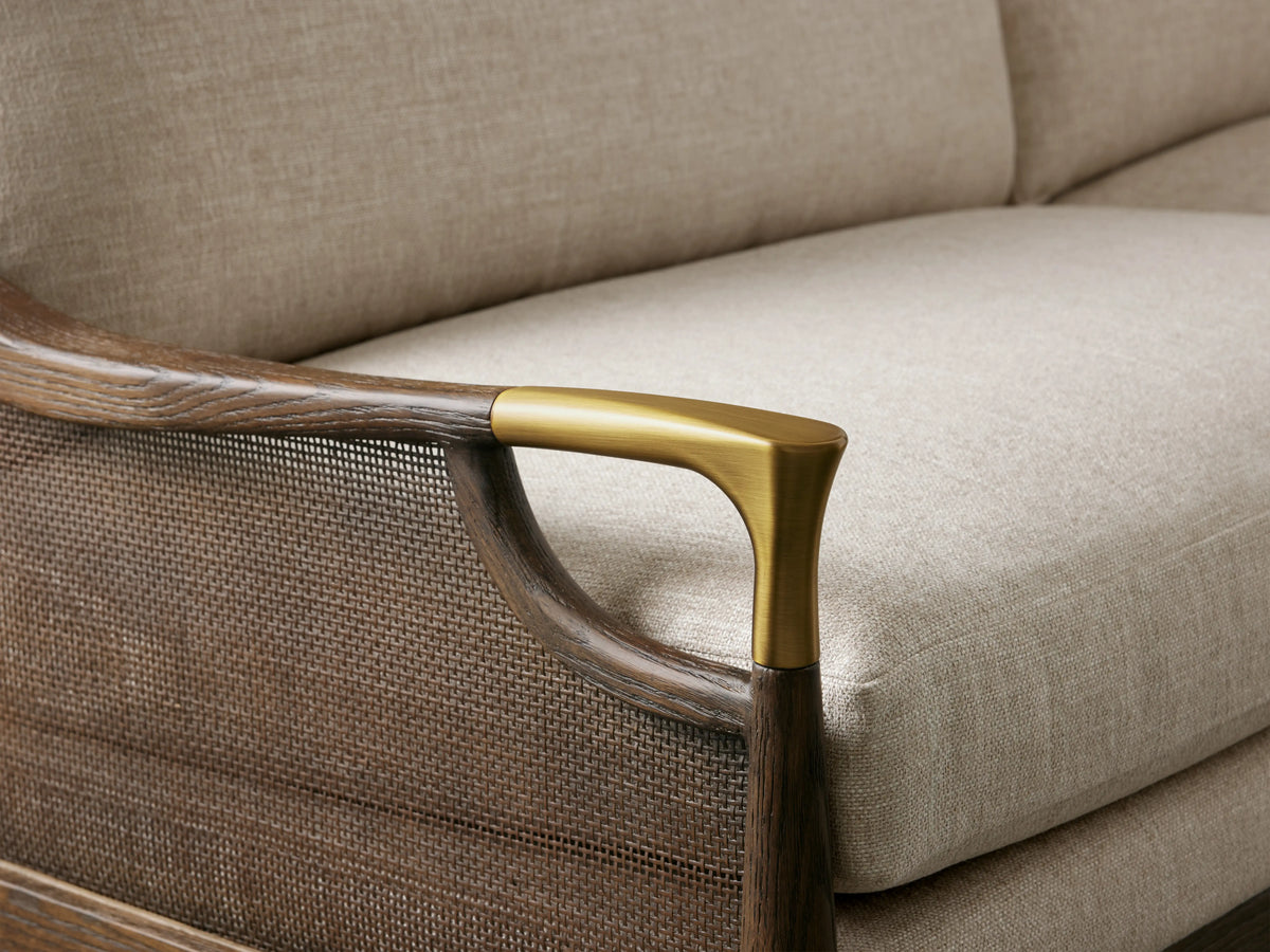 Fisher Cane Back Sofa with a mocha-finished red oak frame, cane paneling, beige cushions, and gold-toned armrest detailing.