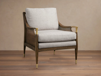Fisher Cane Back Chair with a mocha-finished red oak frame, light gray cushioned seat and back, gold-tipped legs on wood floor.