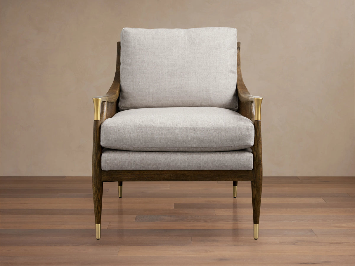 Fisher Cane Back Chair with a mocha-finished red oak frame, light gray cushioned seat and back, gold-tipped legs on wood floor.