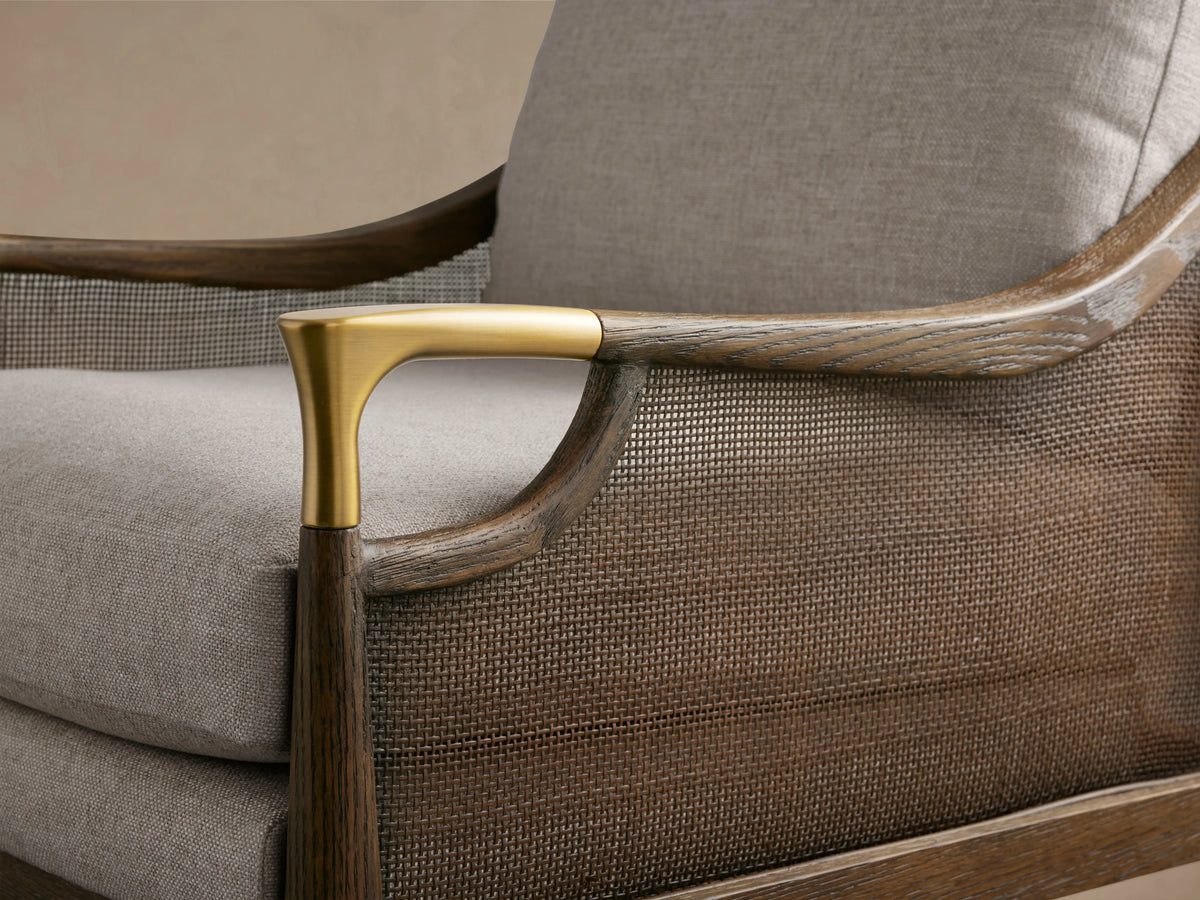 Fisher Cane Back Chair with light gray cushions, red oak frame in mocha finish, and brass-tipped legs on a wooden floor.