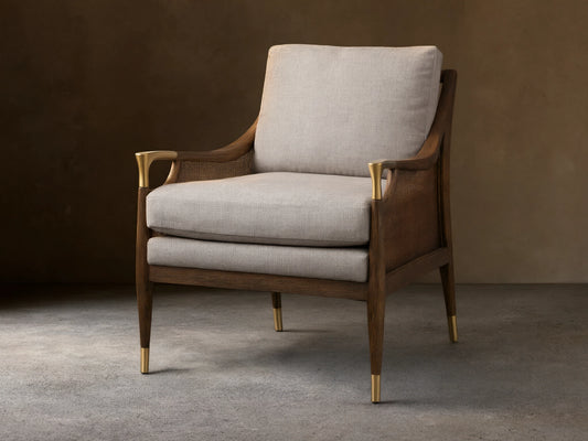 Fisher Cane Back Chair with a mocha-finished red oak frame, light gray cushioned seat and back, gold-tipped legs on wood floor.