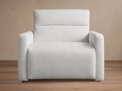 Light grey Rowland Tailored High-Back Motion Recliner, angled left, textured fabric, on wood floor.