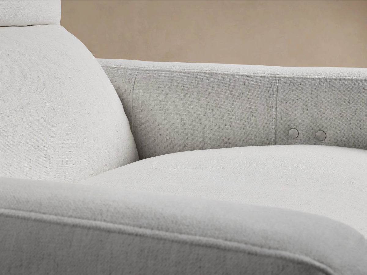 Front view of Rowland Tailored High-Back Motion Recliner in light gray textured fabric, with a high back, on a wood floor.