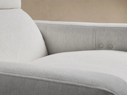 Front view of Rowland Tailored High-Back Motion Recliner in light gray textured fabric, with a high back, on a wood floor.