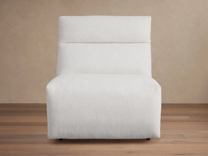 Rowland Tailored 34" Armless Motion Recliner, light grey tailored fabric, plush cushions, angled right on wood floor.