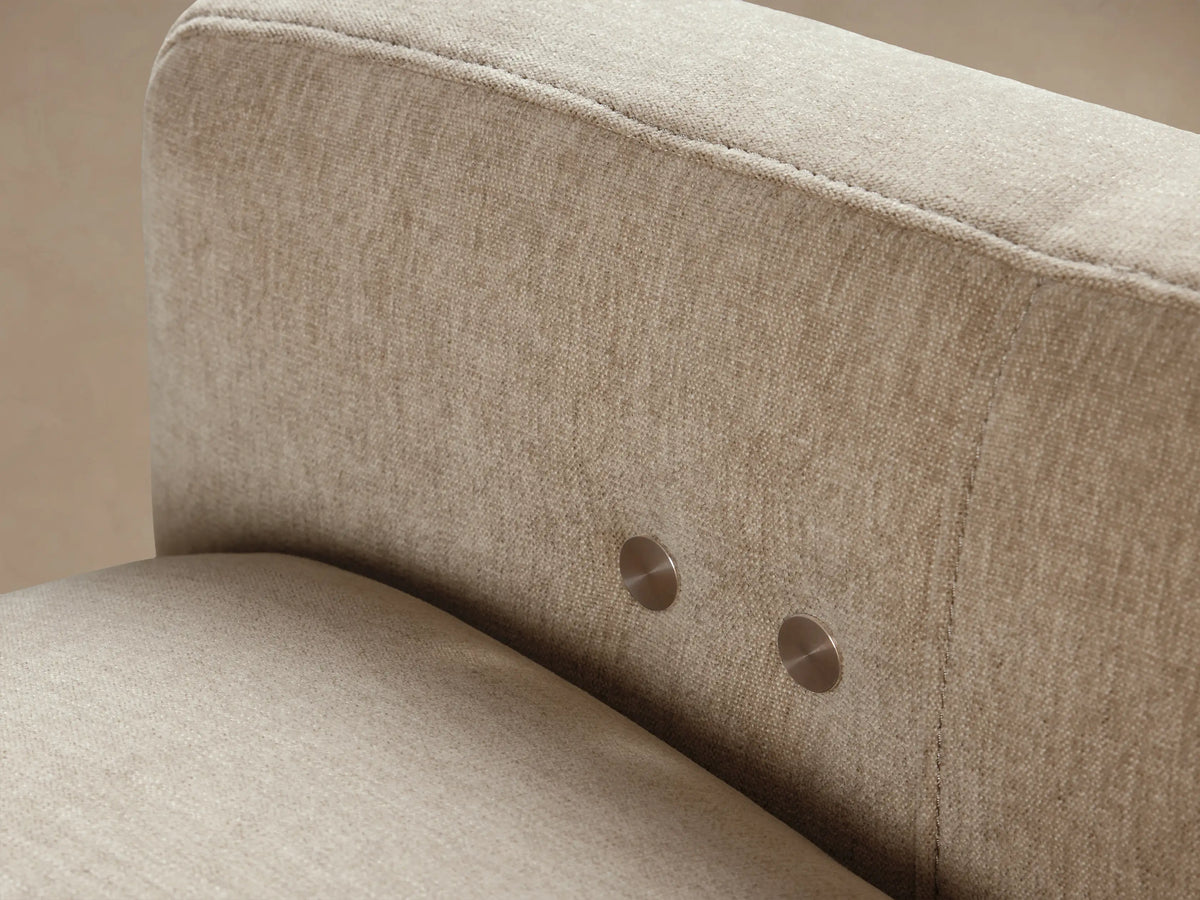 Rowland Tailored High-Back Motion Recliner, upholstered in light beige textured fabric, angled front view on a wood floor.