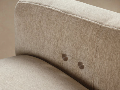 Rowland Tailored High-Back Motion Recliner, upholstered in light beige textured fabric, angled front view on a wood floor.