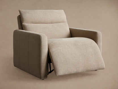 Beige Rowland Tailored High-Back Motion Recliner, side view, fully reclined with footrest extended against a tan wall.
