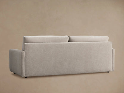 Kipton Sofa in beige fabric, showcasing a plush seat cushion and armrest with clean, modern lines against a neutral background.