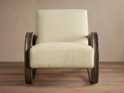 Allora Chair with curved red oak wood frame in Mocha finish, beige textured cushions, on wooden floor, against neutral wall.
