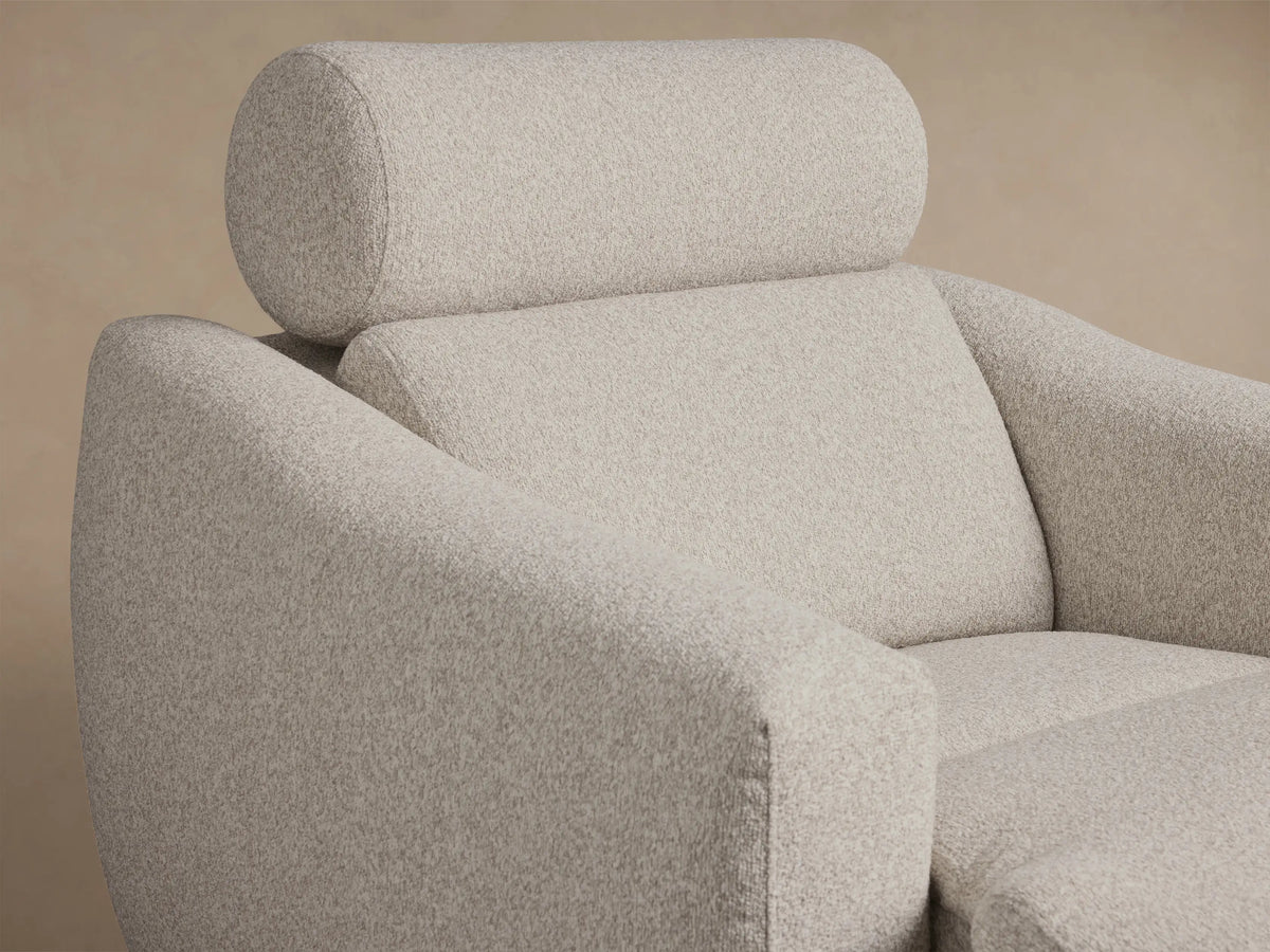 Front view of a light gray textured Fia Motion Recliner with plush cushions and wide rounded arms.