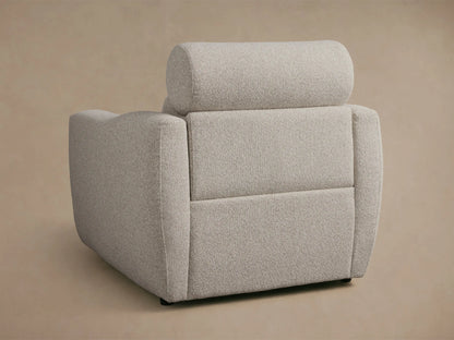 Close-up of a light gray textured Fia Motion Recliner, showing the cylindrical headrest, plush backrest, and wide armrest.