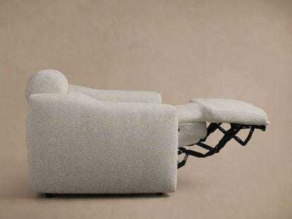 Front view of the light greige textured Fia Motion Recliner with the footrest extended and separate headrest.